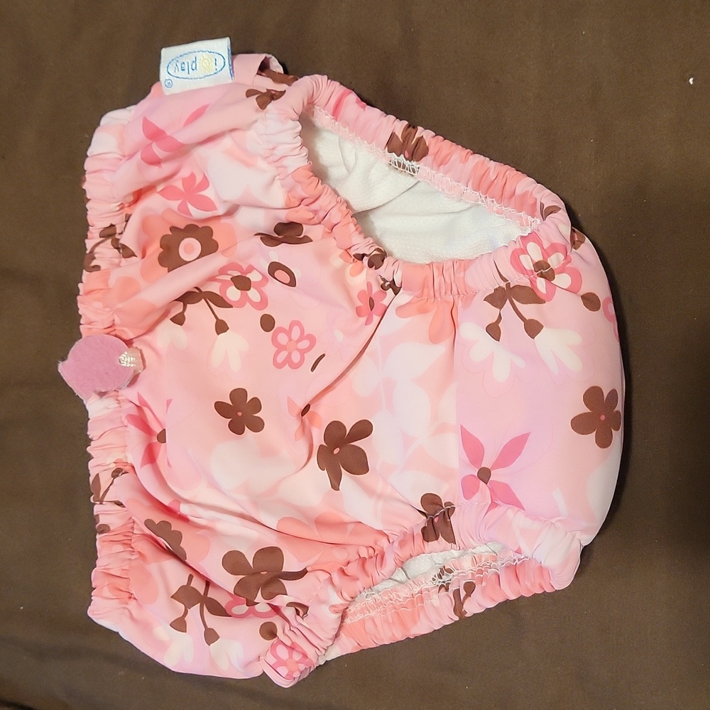 Swim diaper pink with flowers and ruffles on butt. 18m